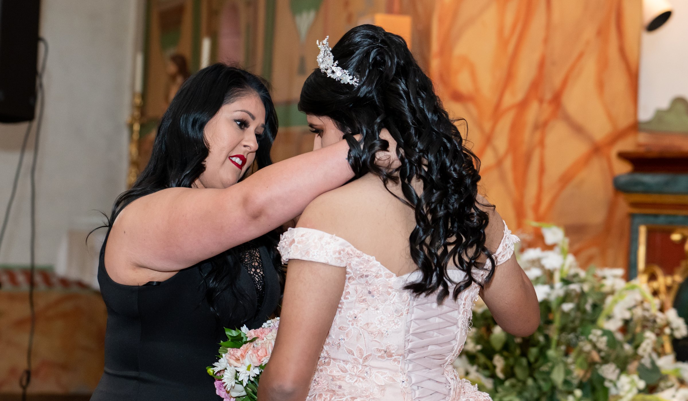 Amanda's daughter's quincinera mother fastening necklace