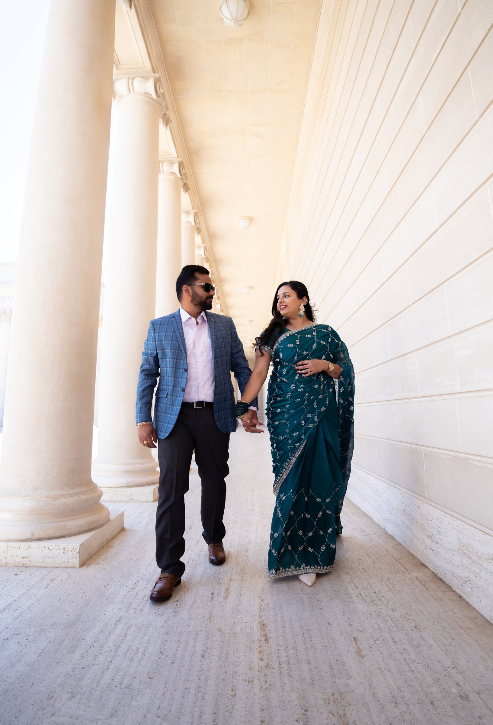 Harpreetandarun's engagement shoot colonnade walk hand in hand