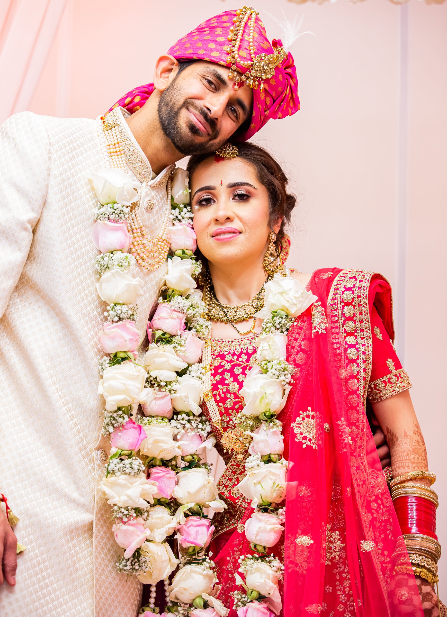 Aditiandnitish groom resting head on bride