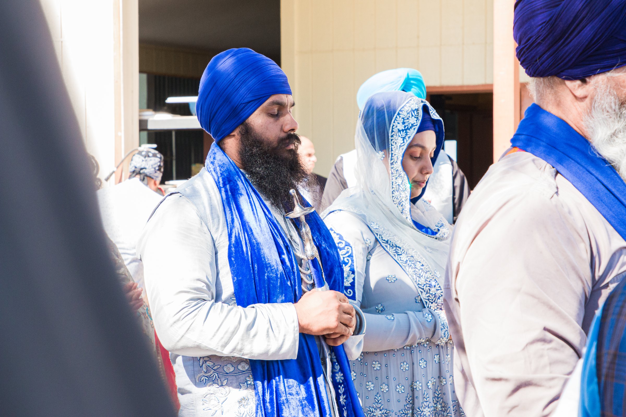 Gursikh wedding jasbir and jaskaran couple in ardas blue and silver