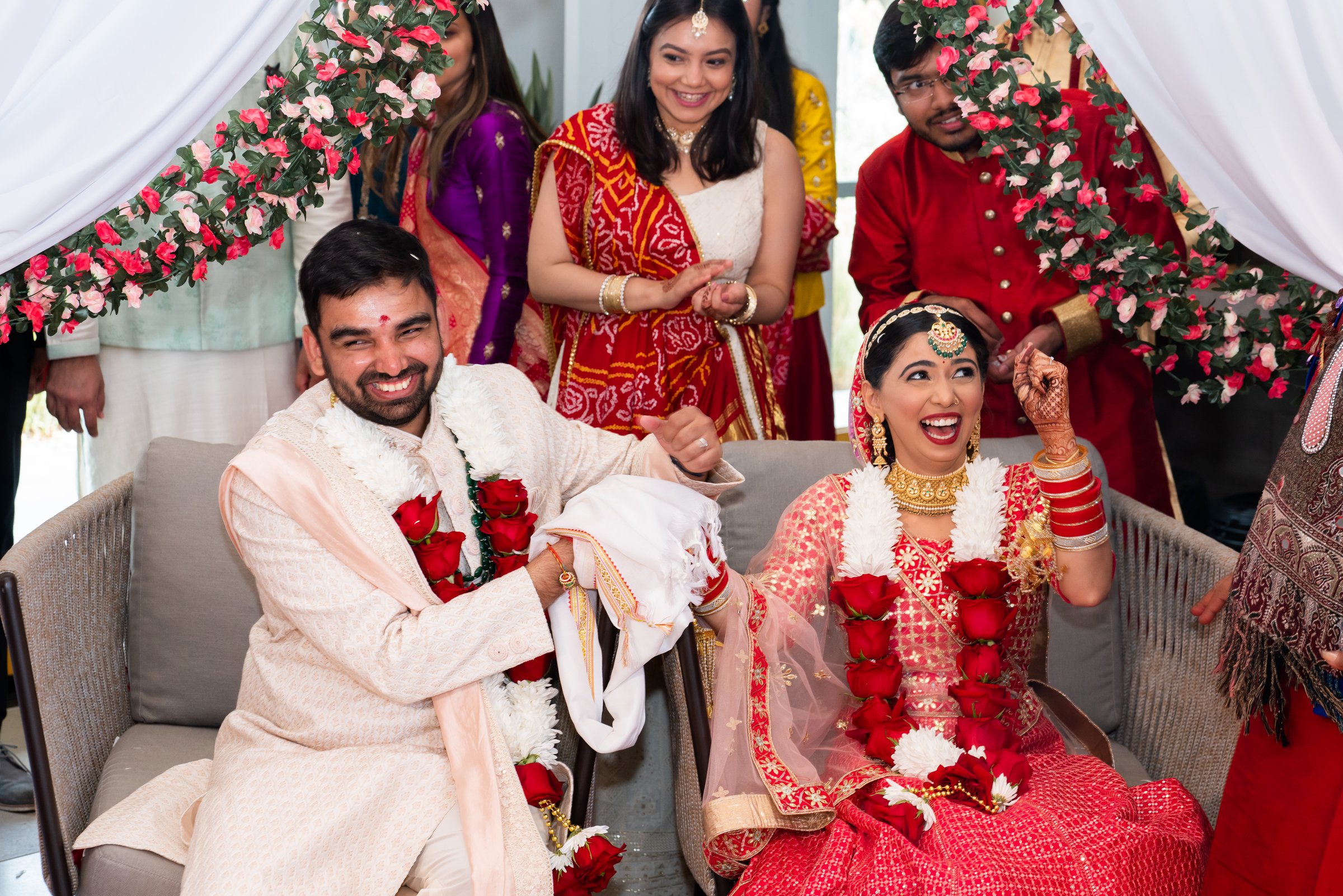 Kshitija and tanay bride laughing at mandap game