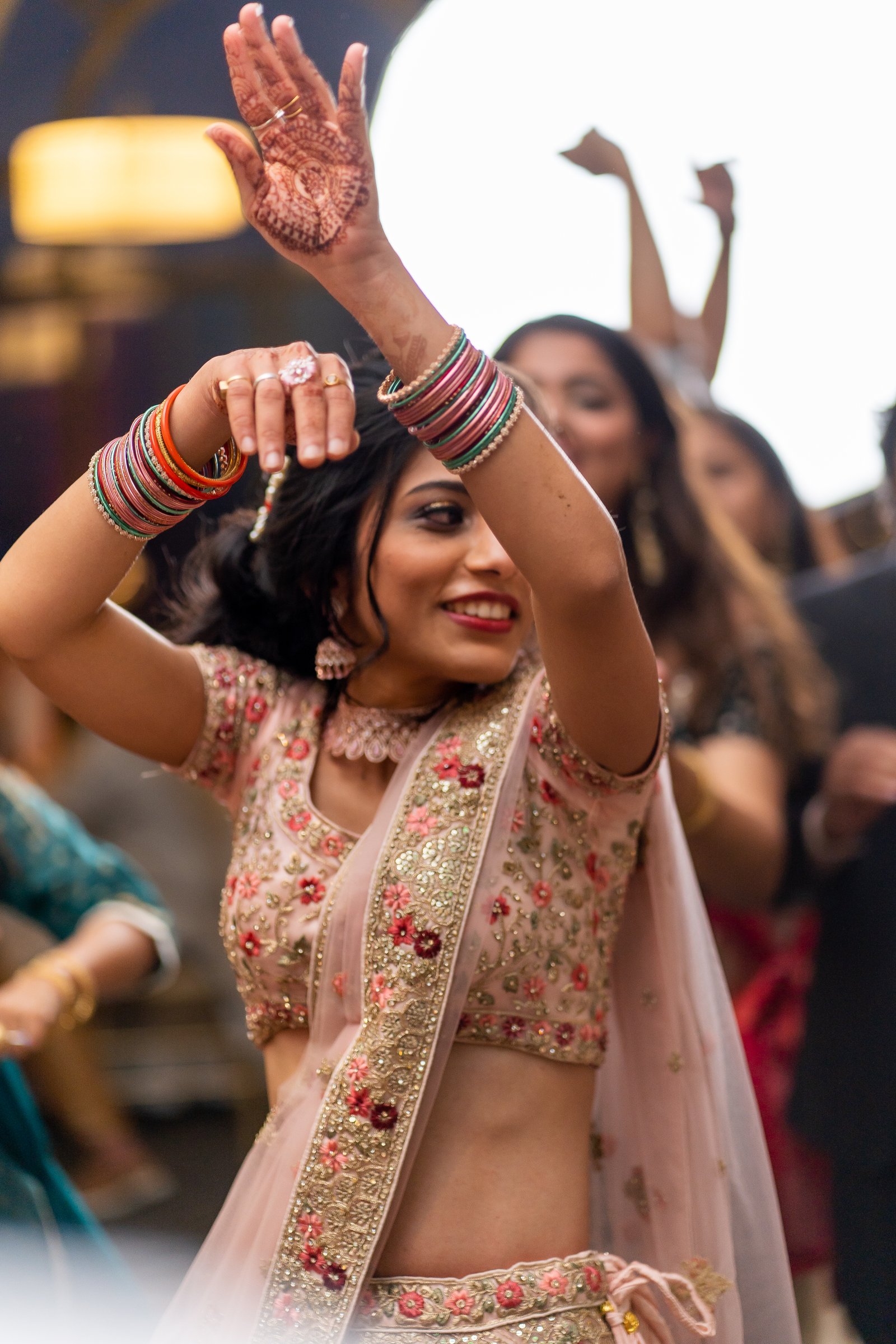 Mayuriandavinash bride dancing henna hands raised