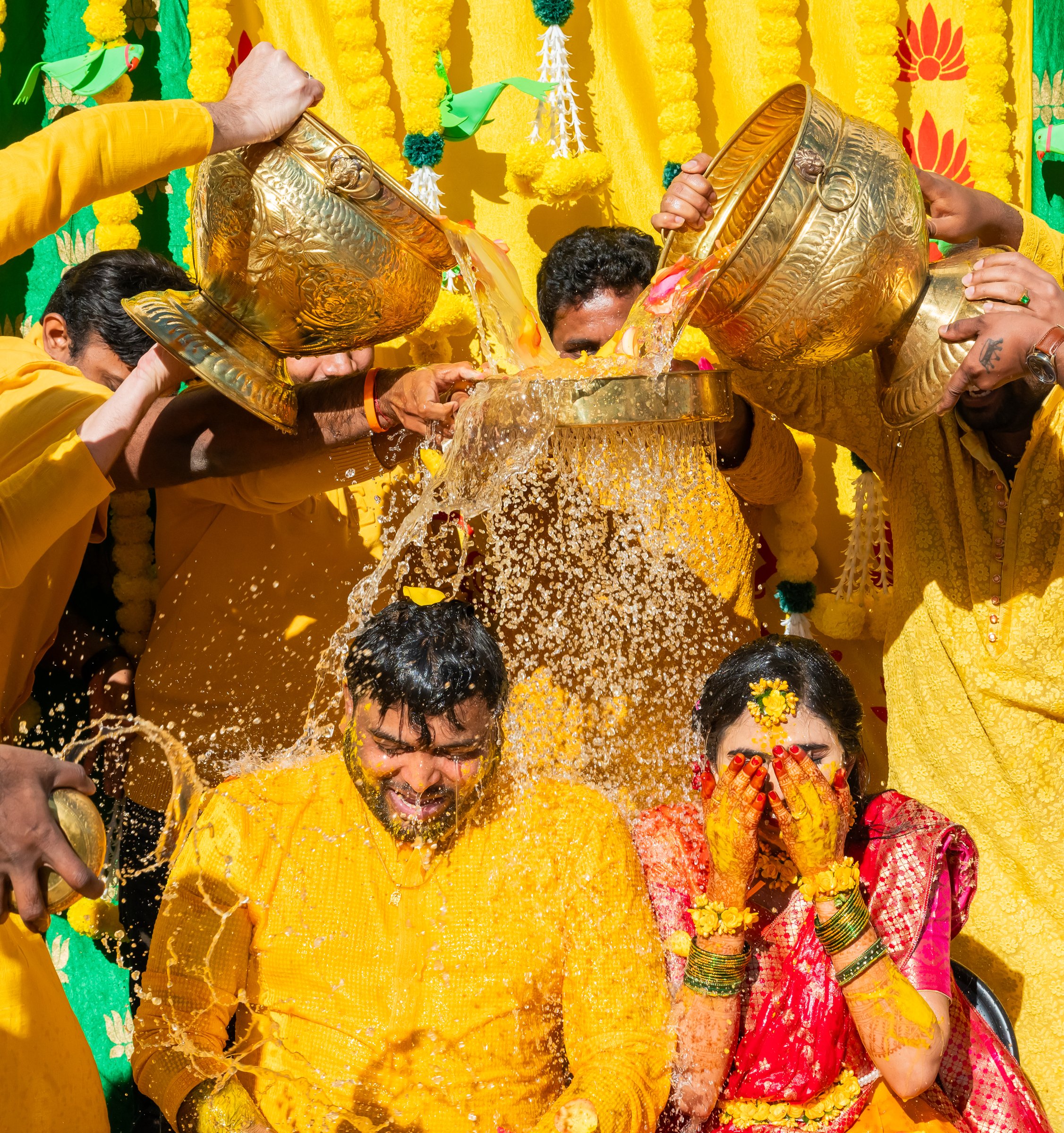 Vyshnavi and akhil haldi water poured from brass pots
